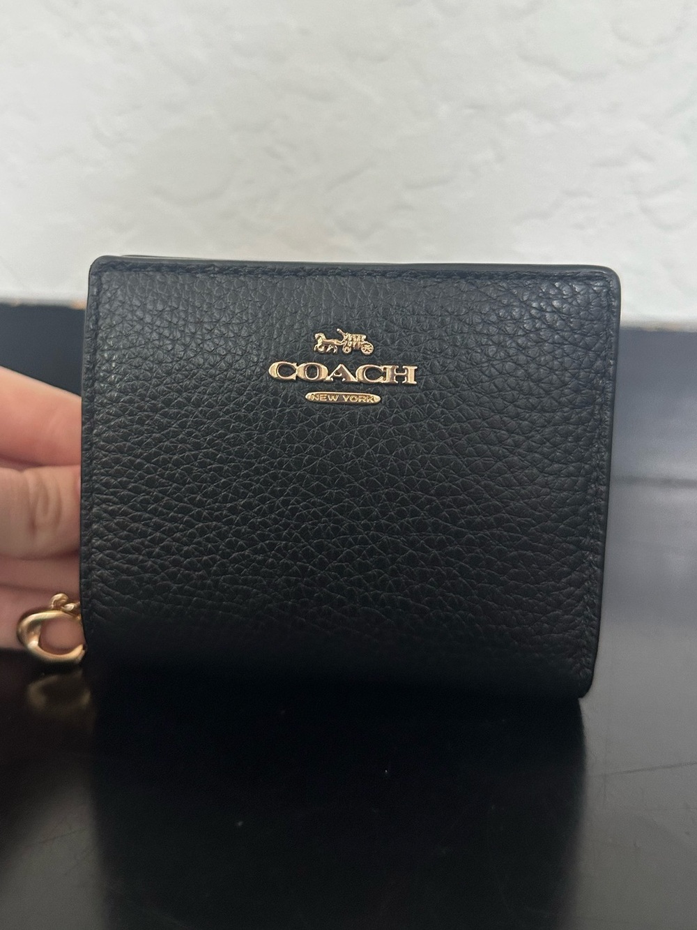 Coach Wallet, snap wallet, black pebbled leather with gold hardware.